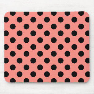 Black polka dots on peach mouse pad