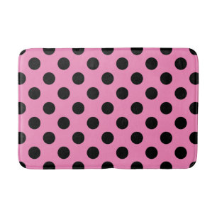 Black polka dots on pink bathroom mat