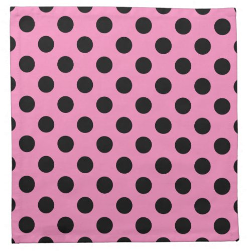 Black polka dots on pink napkin