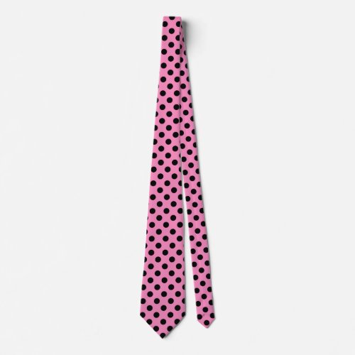 Black polka dots on pink neck tie