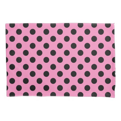 Black polka dots on pink pillow case