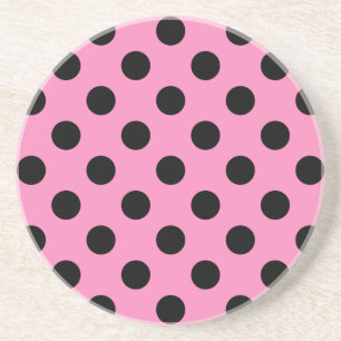 Black polka dots on pink sandstone coaster