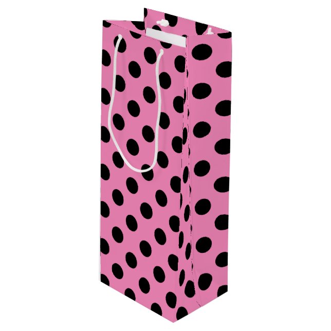 Black polka dots on pink wine gift bag (Front Angled)