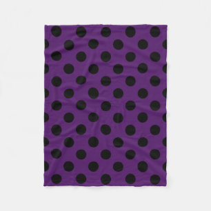 Black polka dots on plum purple fleece blanket