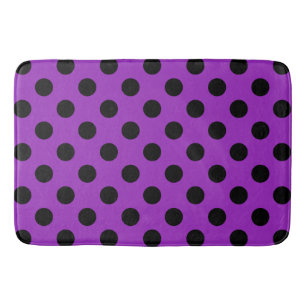 Black polka dots on purple bathroom mat