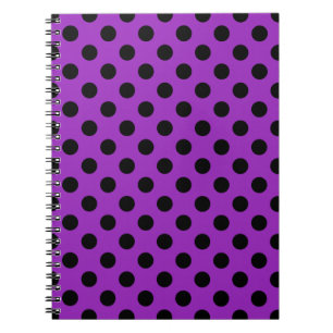Black polka dots on purple notebook
