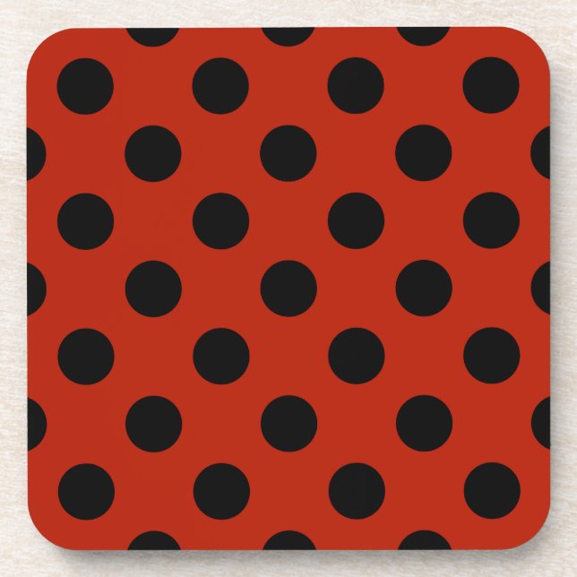 Black polka dots on red beverage coaster (Front)