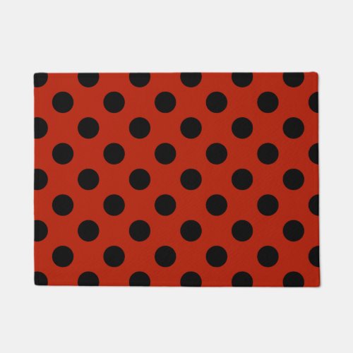 Black polka dots on red doormat