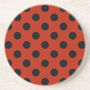 Black polka dots on red drink coaster