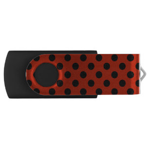 Black polka dots on red flash drive