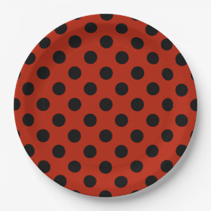 Black polka dots on red paper plates
