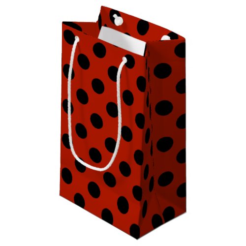 Black polka dots on red small gift bag