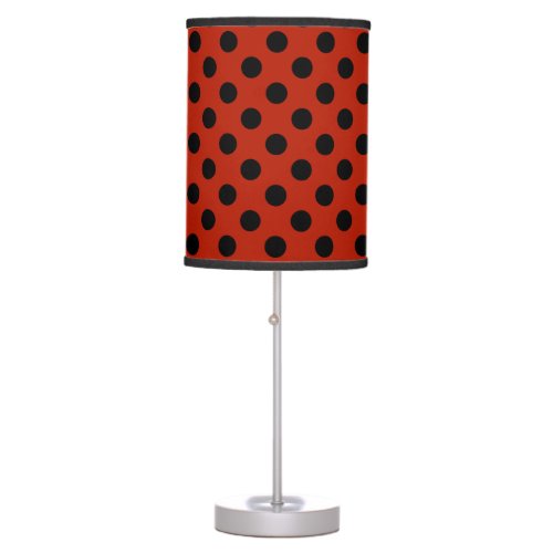 Black polka dots on red table lamp