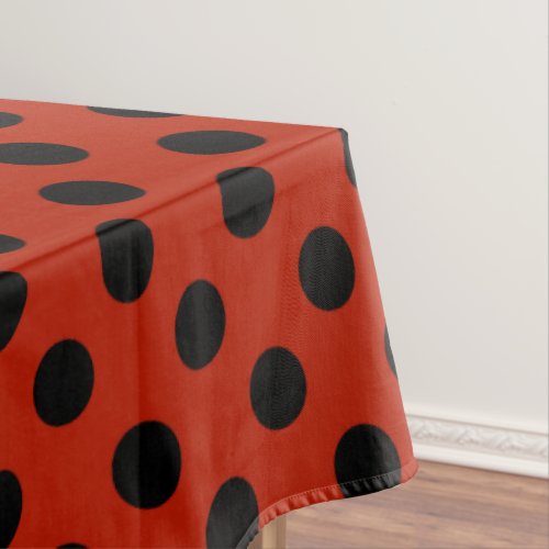 Black polka dots on red tablecloth