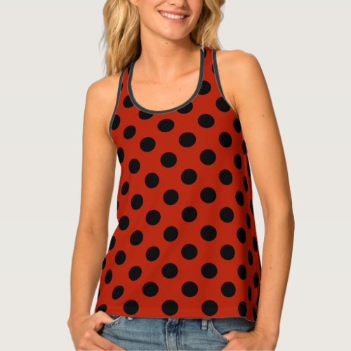 Black polka dots on red tank top