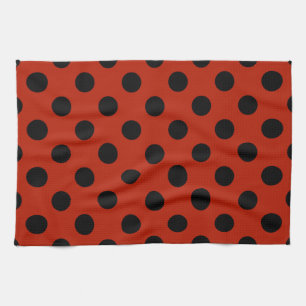 Black polka dots on red towel