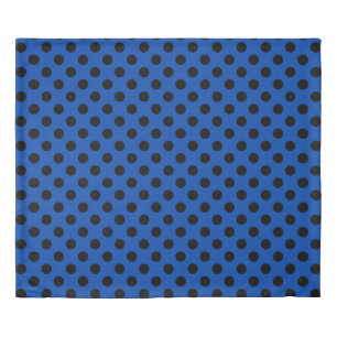 Black polka dots on royal blue duvet cover