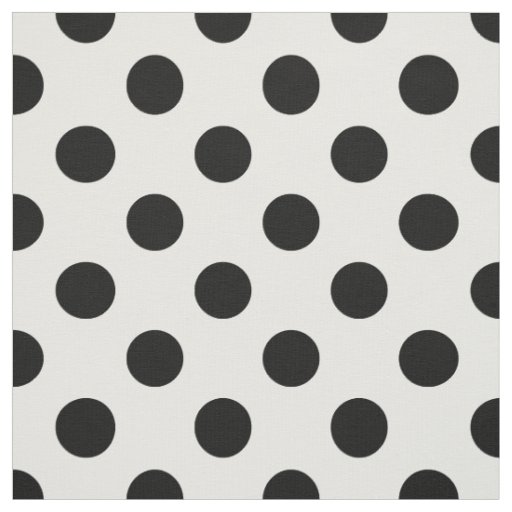 Black polka dots on white fabric
