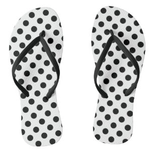 Black polka dots on white flip flops