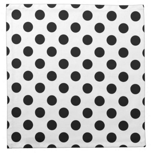 Black polka dots on white napkin