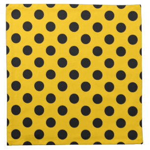 Black polka dots on yellow cloth napkin