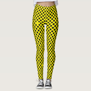 Black polka dots pattern over yellow leggings