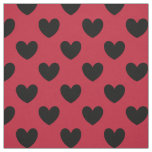Black polka hearts on red fabric