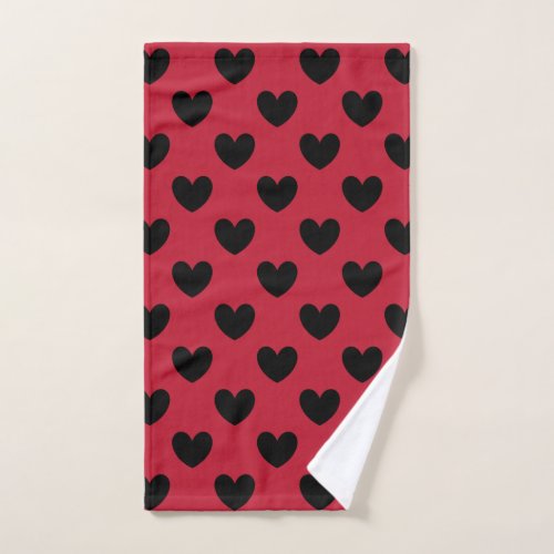 Black polka hearts on red hand towel 