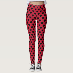 Black polka hearts on red leggings