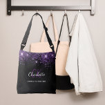 Black purple glitter monogram initials glamorous crossbody bag<br><div class="desc">An elegant black background. Decorated with purple faux glitter dust. Personalize and add your first name,  monogram initials and full name. The name is written with a hand lettered style script.</div>