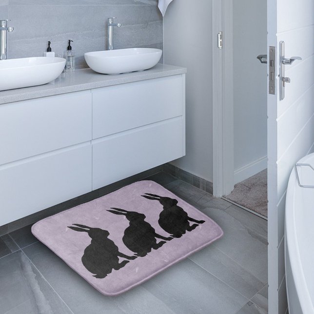 Black Rabbit Silhouette Easter Bunny Bathroom Mat (Three sitting rabbits in black silhouette on marbled purple bath rug.)