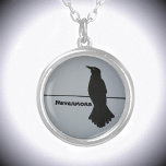 Black Raven Silhouette Customizable Silver Plated Necklace<br><div class="desc">This dramatic gray and black pendant necklace features the silhouette of a solitary Raven perched on a wire against a grey sky. It quotes The Raven Nevermore, but can be personalized with a Name. Throughout history and world cultures, the raven is found in lore, mythology and literature. The raven's symbolism...</div>