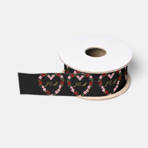 black ribbon with a pink and red heart