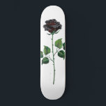 Black rose flower skateboard<br><div class="desc">Symbolic,  artistically drawn black rose with green stems and leaves on white background. Black rose.</div>
