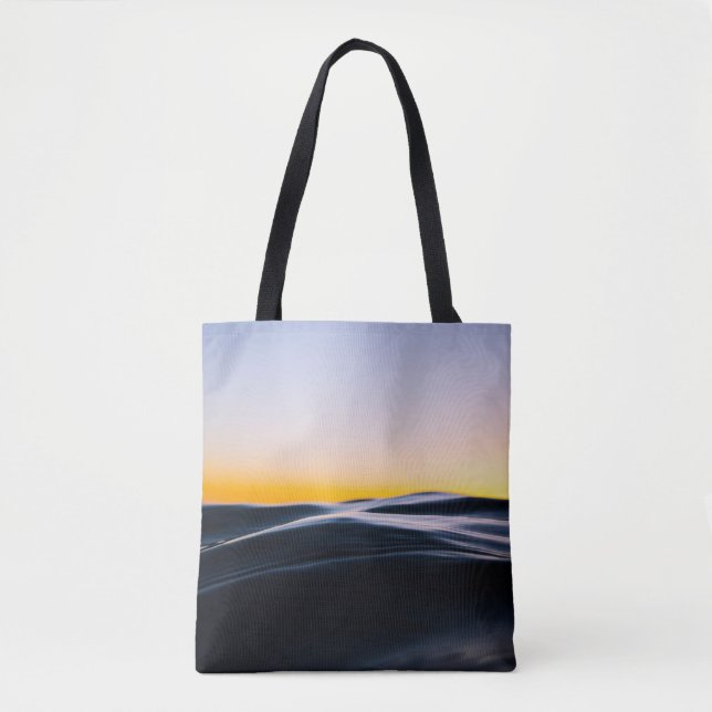 BLACK SAND UNDER ORANGE SKY DURING SUNSET TOTE BAG (Front)