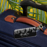 Black silver glitter drips monogram name luggage tag<br><div class="desc">An elegant black background decorated with faux silver glitter drips,  paint dripping look.  Personalize and add a name,  your monogram initials. White and gray colored letters.  Your contact information on the back.</div>