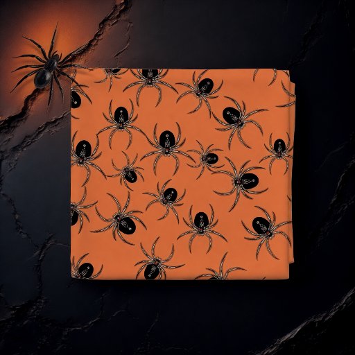 Black spiders on orange  fabric