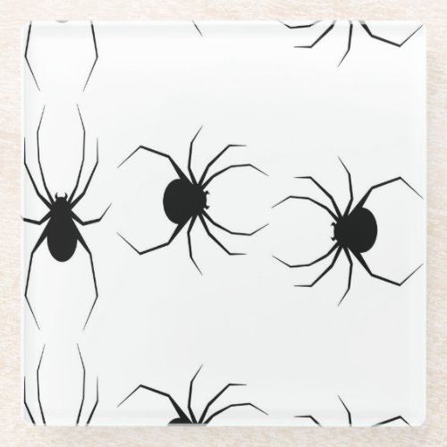 Black spiders on white glass coaster