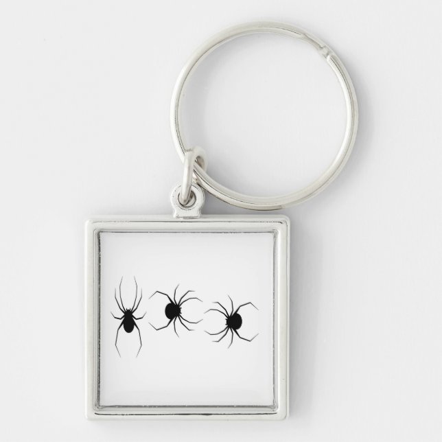 Black spiders on white keychain (Front)