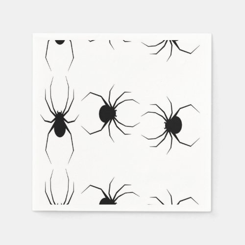 Black spiders on white napkins