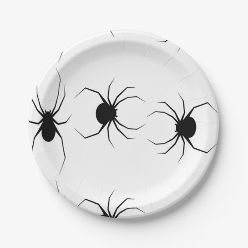 Black spiders on white paper plate