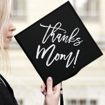 Black | Thanks Mom  Graduation Cap Topper<br><div class="desc">Thank your mom for her support by wearing a custom graduation cap topper in their honor. The stylish graduation cap topper features "Thanks Mom!" in a trendy modern script font against a black background.</div>
