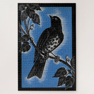 black thrush with blue jigsaw puzzle