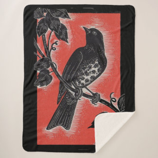black thrush with red sherpa blanket
