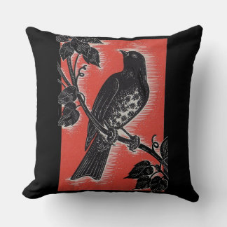 black thrush with red throw pillow