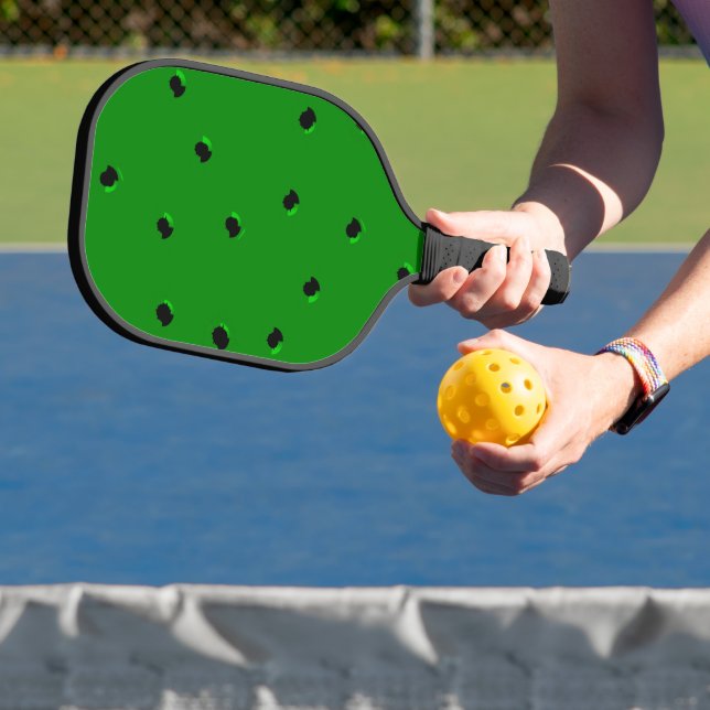 Black tiny holes on green pickleball paddle (Insitu)