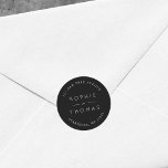 Black Wedding Return Address Classic Round Sticker<br><div class="desc">This wedding return address sticker features the names of the wedding couple and address in white against a black color. Check out the matching wedding items here https://www.zazzle.com/collections/119930609931325936 Personalize it by replacing the placeholder text. For more options such as to change the font, it's size and spacing between letters click...</div>