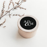 Black & White Ampersand Monogram Wedding Classic Round Sticker<br><div class="desc">Seal your invitation envelopes or favors with these elegant solid color wedding stickers featuring your initials worked into a monogram joined by a decorative script ampersand,  on a crisp black background for a simple and timeless look. Designed to match our Ampersand Monogram wedding invitation collection.</div>