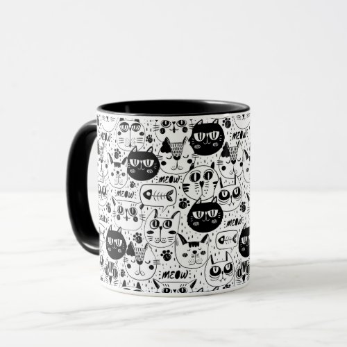 Black white cats faces pattern mug