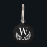 Black white classic wreath monogram initial dog pet ID tag<br><div class="desc">A stylsih black background decorated with a classic wreath . Personalize and add the pet's monogram initial. Add your phone number on the back. White colored letters.</div>